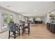 Open concept living and recreation area with ping pong table and bar with seating at 4522 Majestic Hills Loop, Brooksville, FL 34601