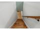 Classic wooden staircase with white walls, offering a simple design with a touch of elegance at 4522 Majestic Hills Loop, Brooksville, FL 34601