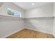 Empty walk-in closet with vinyl flooring and ample shelving for organized storage at 4522 Majestic Hills Loop, Brooksville, FL 34601