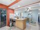 Kitchen island with seating and stainless steel appliances at 4700 Cove Cir # 301, St Petersburg, FL 33708