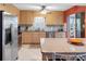 Kitchen features stainless steel appliances, light wood cabinetry, and granite countertops at 4700 Cove Cir # 301, St Petersburg, FL 33708