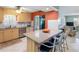 Kitchen with center island, counter seating, and stainless steel appliances at 4700 Cove Cir # 301, St Petersburg, FL 33708