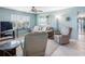 Cozy living room with plush seating, neutral decor, and a seamless transition to the adjacent tiled hallway at 4700 Cove Cir # 301, St Petersburg, FL 33708