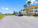 A paved parking lot outside the building, providing convenient access to the water view and manicured landscaping at 4700 Cove Cir # 301, St Petersburg, FL 33708