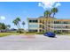 Convenient parking spot at this building with well-manicured landscaping and swaying palm trees at 4700 Cove Cir # 301, St Petersburg, FL 33708