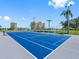 Well-maintained tennis court with benches, providing an athletic outlet at 4700 Cove Cir # 301, St Petersburg, FL 33708