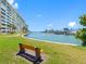 Enjoy the tranquility of this serene water view, complete with a bench for relaxation at 4700 Cove Cir # 301, St Petersburg, FL 33708