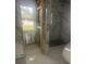 Bathroom featuring new tile work and window, ready for fixtures at 4824 Huntington Ne St, St Petersburg, FL 33703
