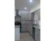 Stylish kitchen with stainless steel appliances, granite countertops, and soft-close cabinetry at 4824 Huntington Ne St, St Petersburg, FL 33703