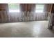 Renovated living room with tile floor and ready for new decor at 4824 Huntington Ne St, St Petersburg, FL 33703