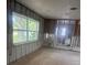 Bright living room with large windows awaiting customization and design at 4824 Huntington Ne St, St Petersburg, FL 33703