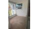 Small covered patio with tile flooring and a window at 4824 Huntington Ne St, St Petersburg, FL 33703