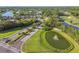 Aerial view with a lake, a golf course, and beautiful landscaping add curb appeal to the neighborhood at 5027 Cross Pointe Dr, Oldsmar, FL 34677
