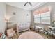 Adorable Bedroom room with crib, pink accents, and alphabet rug at 5027 Cross Pointe Dr, Oldsmar, FL 34677
