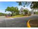 Beautiful community clubhouse welcomes residents with manicured landscaping and an elegant architectural design at 5027 Cross Pointe Dr, Oldsmar, FL 34677