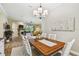 Bright dining room with a wooden table and decorative accents next to the living room at 5027 Cross Pointe Dr, Oldsmar, FL 34677