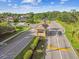 View of neighborhood entrance with guard house, speed bump, landscaping and signage at 5027 Cross Pointe Dr, Oldsmar, FL 34677