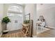 Bright foyer with double doors, a decorative table and a view into the dining room at 5027 Cross Pointe Dr, Oldsmar, FL 34677