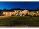 Charming exterior view of a one-story home showcasing a manicured lawn and inviting curb appeal at twilight at 5027 Cross Pointe Dr, Oldsmar, FL 34677