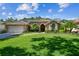 Charming single story home featuring mature landscaping, a tile roof, and a two-car garage at 5027 Cross Pointe Dr, Oldsmar, FL 34677