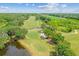 An aerial shot of the lush golf course with water feature at 5027 Cross Pointe Dr, Oldsmar, FL 34677