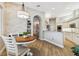 Eat-in kitchen with white cabinetry, stainless appliances, and a decorative accent wall at 5027 Cross Pointe Dr, Oldsmar, FL 34677