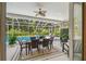 Covered patio with dining set and view of the backyard pool and hot tub at 5027 Cross Pointe Dr, Oldsmar, FL 34677
