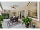 Outdoor patio boasts a ceiling fan, dining area, and a view of the screened in lanai at 5027 Cross Pointe Dr, Oldsmar, FL 34677