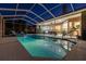 A stunning pool and patio area with a screened enclosure and plenty of space for outdoor entertaining at 5027 Cross Pointe Dr, Oldsmar, FL 34677