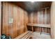 Sauna room with wooden walls and a wooden bench at 5027 Cross Pointe Dr, Oldsmar, FL 34677