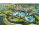 An aerial view of community amenities, including a pool, walking paths, and lush landscaping at 5410 Morey Farms Loop, Palmetto, FL 34221