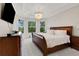 Spacious bedroom featuring large windows, a tray ceiling, and neutral décor at 5410 Morey Farms Loop, Palmetto, FL 34221