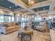 Spacious clubhouse lounge area with a high ceiling, stylish furniture, and large windows at 5410 Morey Farms Loop, Palmetto, FL 34221