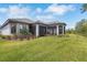 Exterior elevation showing backyard, lanai and manicured landscaping at 5410 Morey Farms Loop, Palmetto, FL 34221