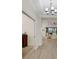 Bright, neutral hallway leading to the living room, highlighting open floor plan at 5410 Morey Farms Loop, Palmetto, FL 34221