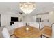 Open floor plan showcases a gorgeous chandelier, a kitchen island, and a cozy living room at 5410 Morey Farms Loop, Palmetto, FL 34221