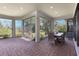 Sunroom patio with brick flooring and sliding glass windows showing outdoor landscape at 5410 Morey Farms Loop, Palmetto, FL 34221