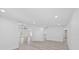 Open concept living area with modern flooring and bright lighting provides ample space for entertaining at 5507 Nimitz Rd, New Port Richey, FL 34652