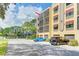 An exterior view showcasing the building's architecture with private garage parking at 5849 Park N St # 412, St Petersburg, FL 33709
