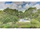 Beautiful lake view surrounded by lush trees and vibrant green landscape at 5849 Park N St # 412, St Petersburg, FL 33709