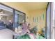 A furnished lanai with a slider to the living area at 5849 Park N St # 412, St Petersburg, FL 33709