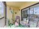 Relaxing screened lanai featuring an outdoor seating area and decorative accents at 5849 Park N St # 412, St Petersburg, FL 33709