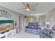 Open-concept living room with tile flooring and a view of the dining area at 5849 Park N St # 412, St Petersburg, FL 33709