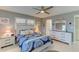 Main bedroom features a ceiling fan, window with shutters, and is nicely decorated at 5849 Park N St # 412, St Petersburg, FL 33709