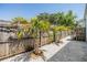 Backyard features a gravel space with palm trees and a wooden fence at 6036 110Th N Ave, Pinellas Park, FL 33782