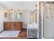 Bathroom showcasing double sink vanity, soaking tub, and a shower with decorative tile at 6036 110Th N Ave, Pinellas Park, FL 33782