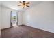 Bedroom featuring neutral carpet, ceiling fan, and a window at 6036 110Th N Ave, Pinellas Park, FL 33782