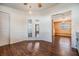 Dining room features wood floors and large windows, open to other living spaces at 6036 110Th N Ave, Pinellas Park, FL 33782