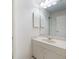 Bright bathroom with a large mirror, vanity, and neutral decor at 6201 Amaretto Ln # 6201, Tampa, FL 33634