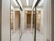Mirrored view of bathroom featuring a shower-tub combo, and neutral tile at 6201 Amaretto Ln # 6201, Tampa, FL 33634